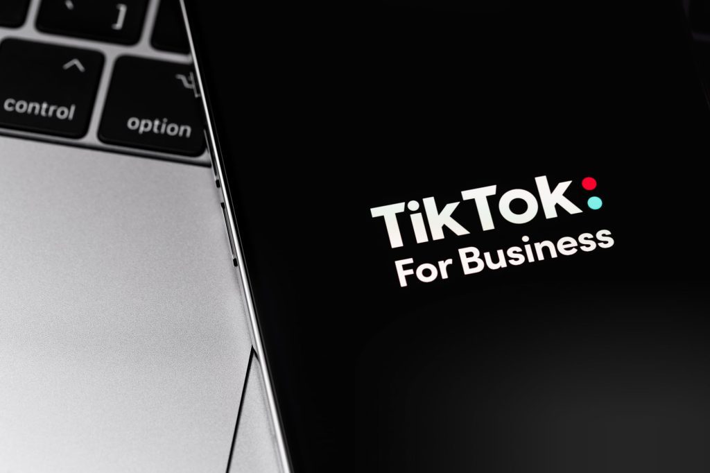 TikTok For Business on screen smartphone closeup. TikTok is app to create and share videos. Moscow, Russia - November 9, 2021