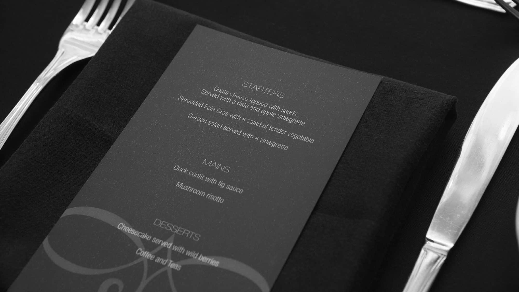 Restaurant menu on table for guests black and white