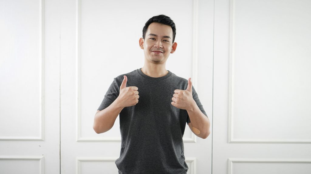 Man holding thumbs up sign