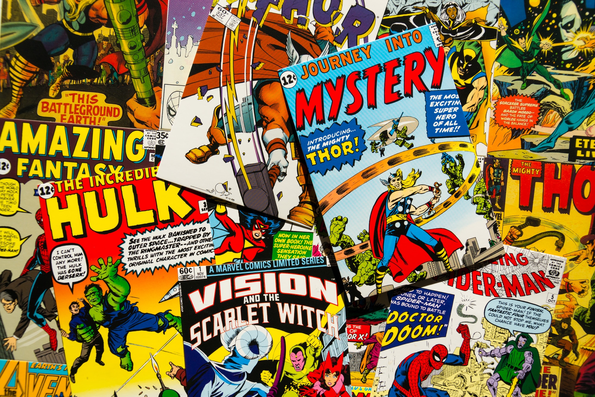 PRAGUE, CZECH REPUBLIC - JANUARY 29: Colorful vintage comic magazine covers top view flat lay composition on January 29, 2018 in Prague, Czech Republic.