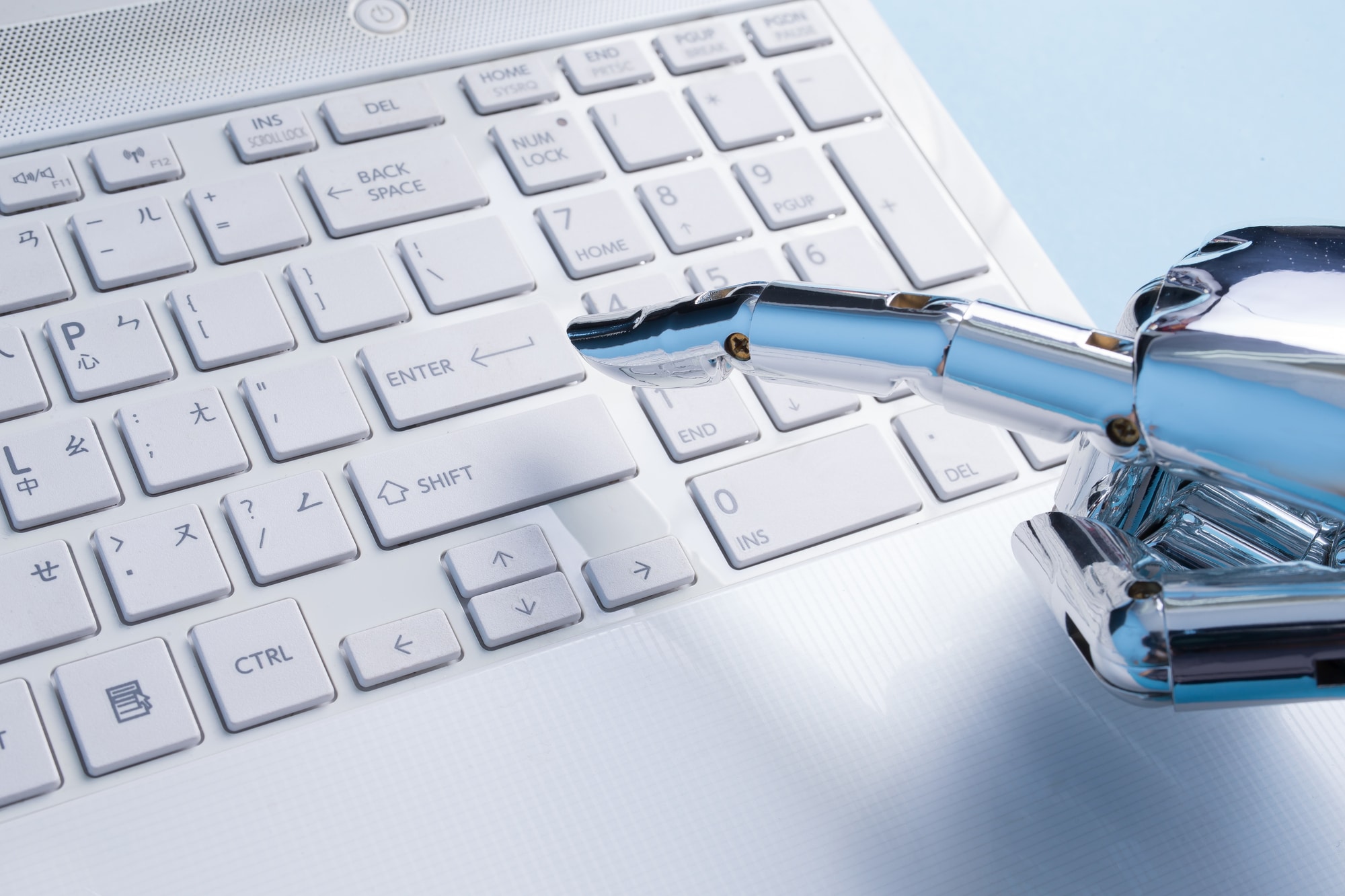 robot hand use notebook work on the blue background