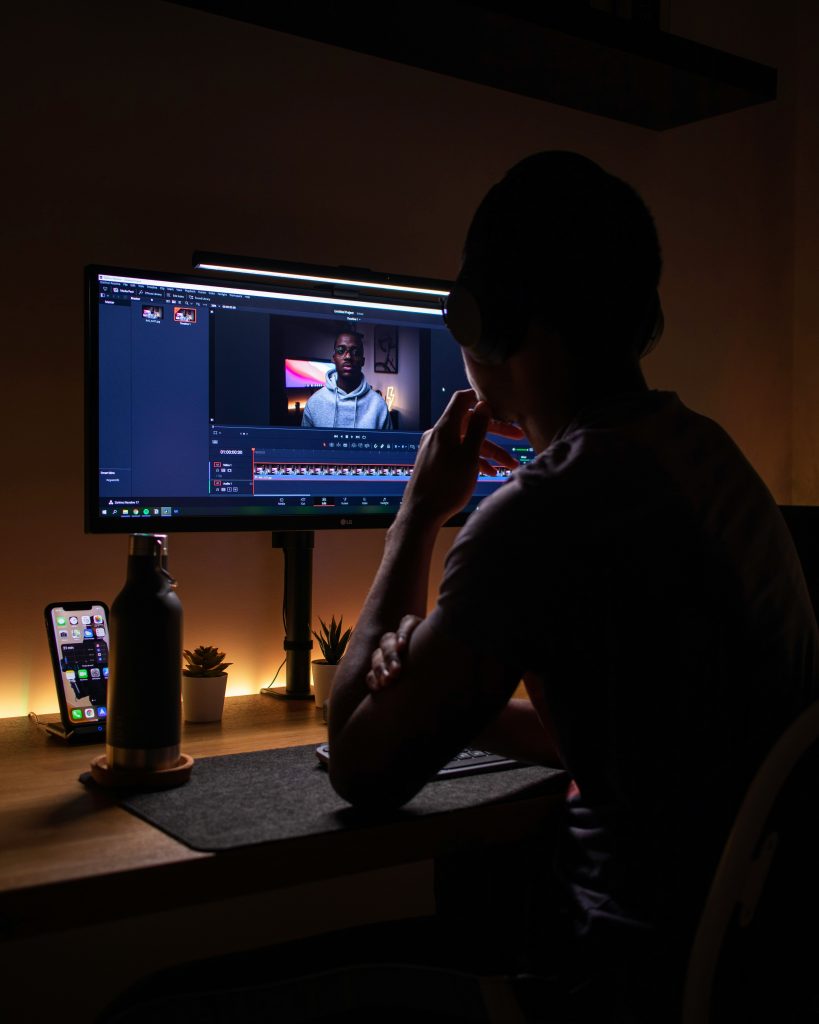 person sitting at a computer screen working