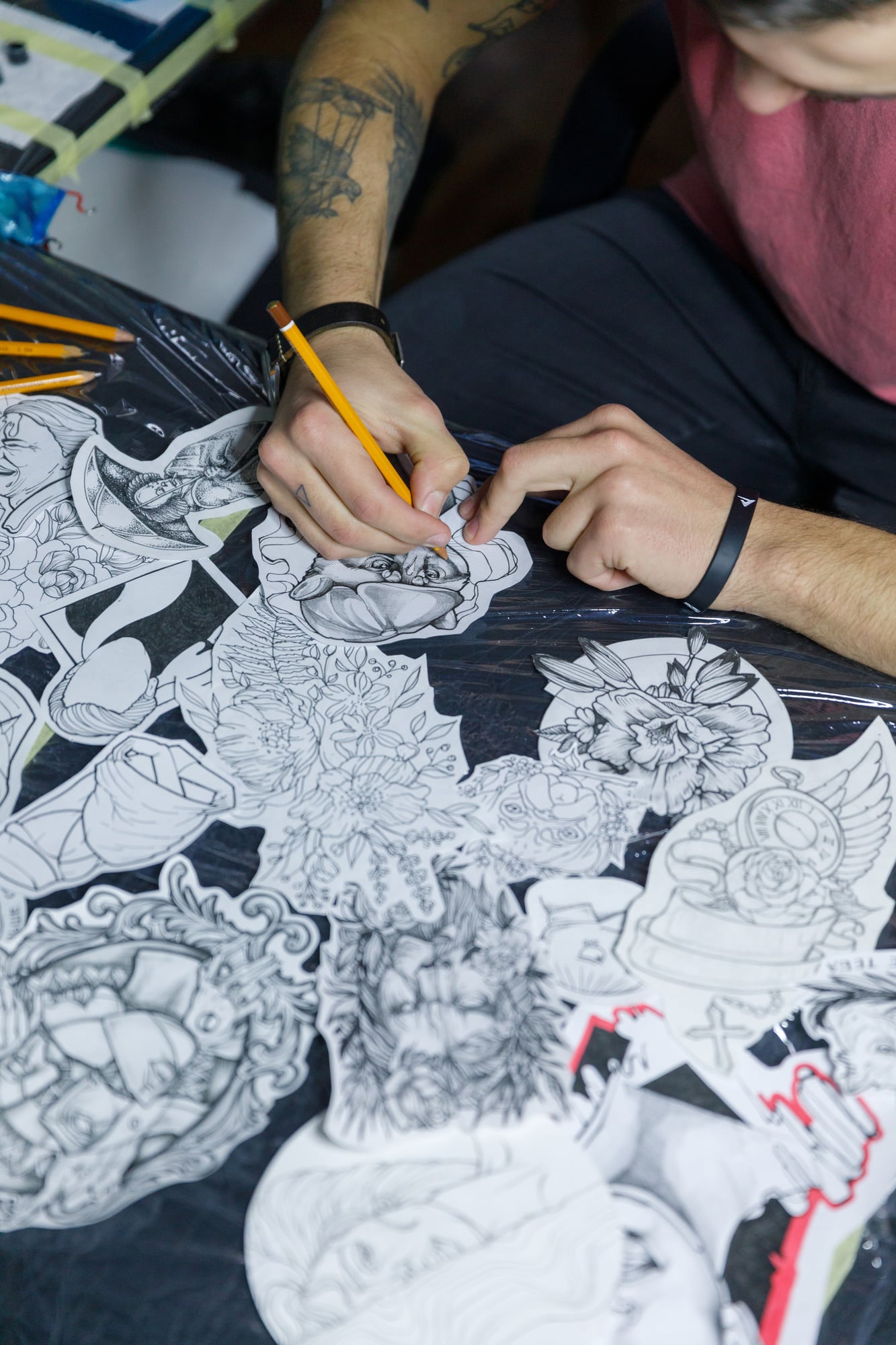 stock-photo-of-tattoo-artist-designing-tattoos