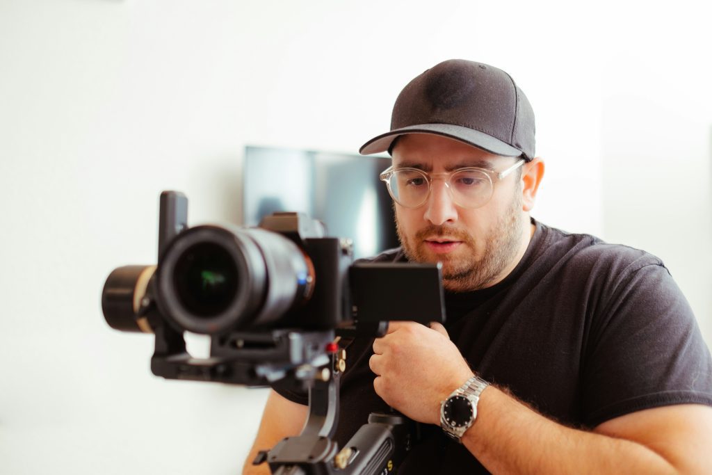 Man shooting a video with a camera