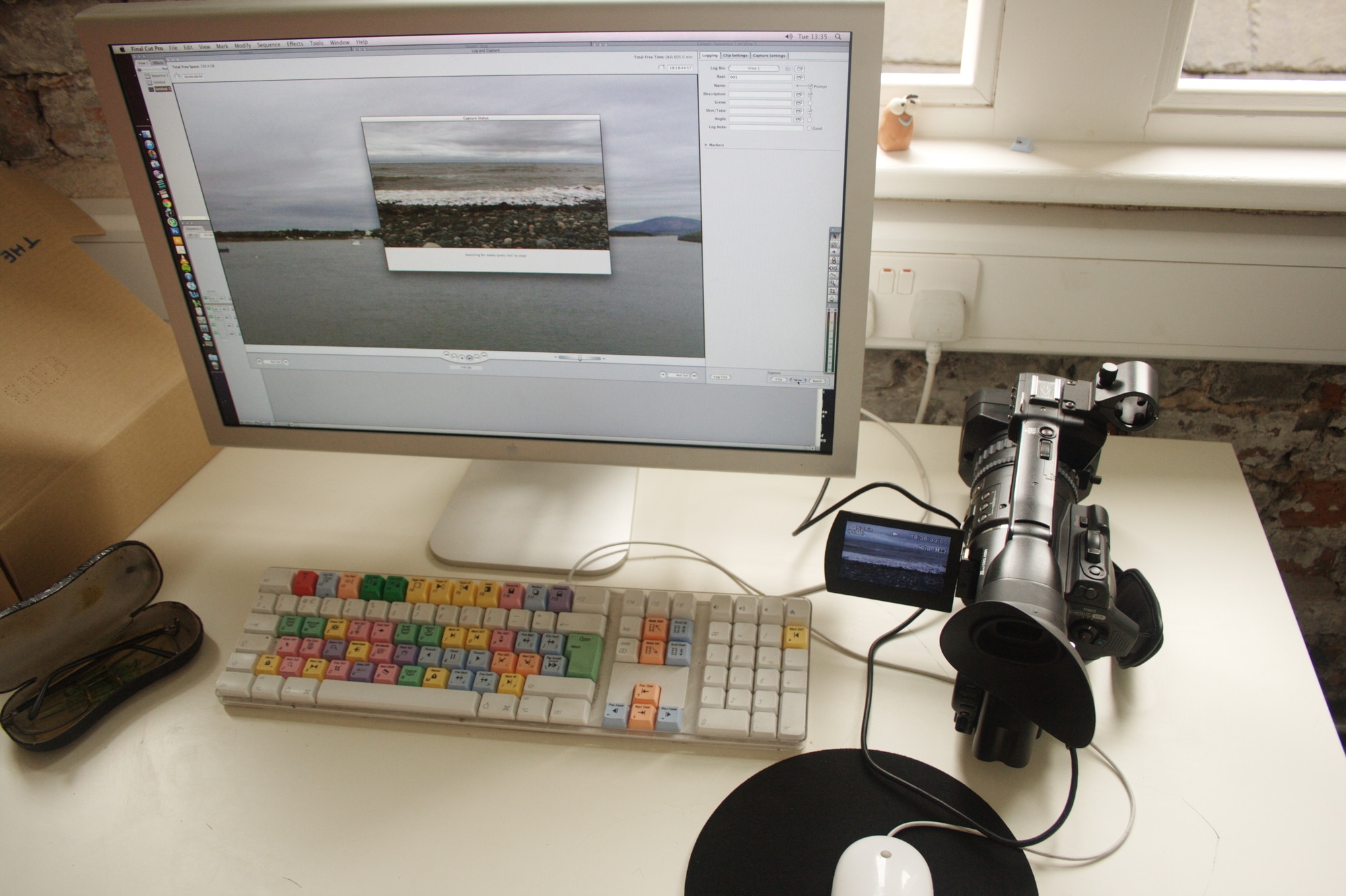 video camera connected to an Apple Macintosh computer to transfer film footage for digital editing.