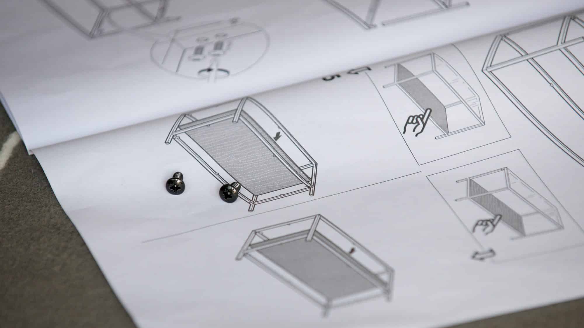 Close up of scerws, instructions for furniture assembly instructions illustrated manual