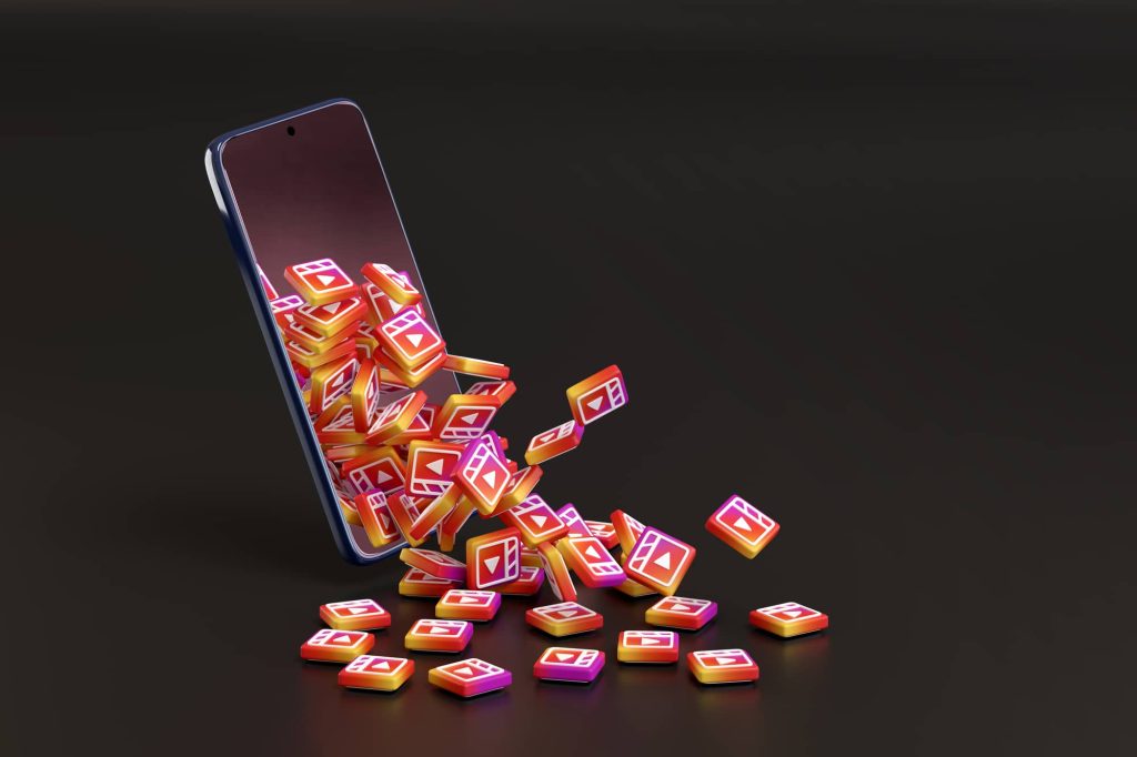 Buenos Aires, Argentina - September 4, 2021: Many Instagram reels logos coming out of a mobile phone on black background. 3d illustration.