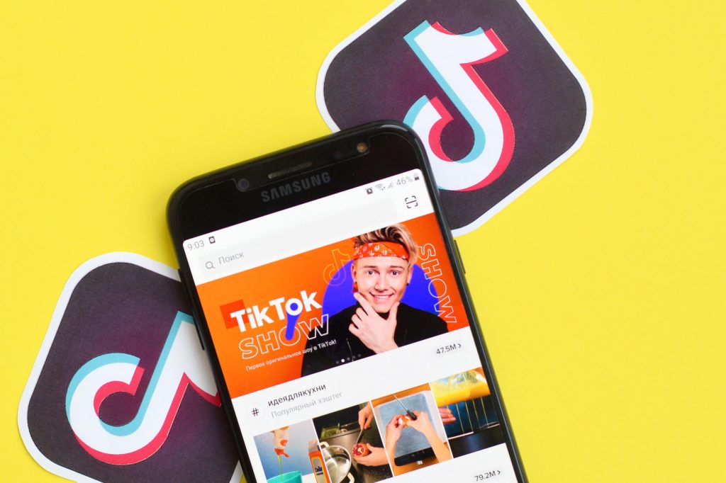 NY, USA - DECEMBER 5, 2019: Tiktok application on samsung smartphone screen on yellow background. TikTok is a popular video-sharing social networking service owned by ByteDance