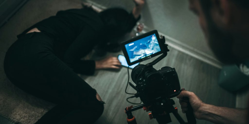 person filming a video shown