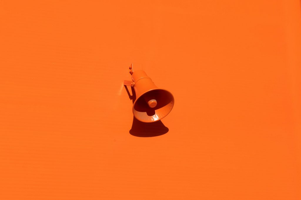 Orange speaker on an orange wall